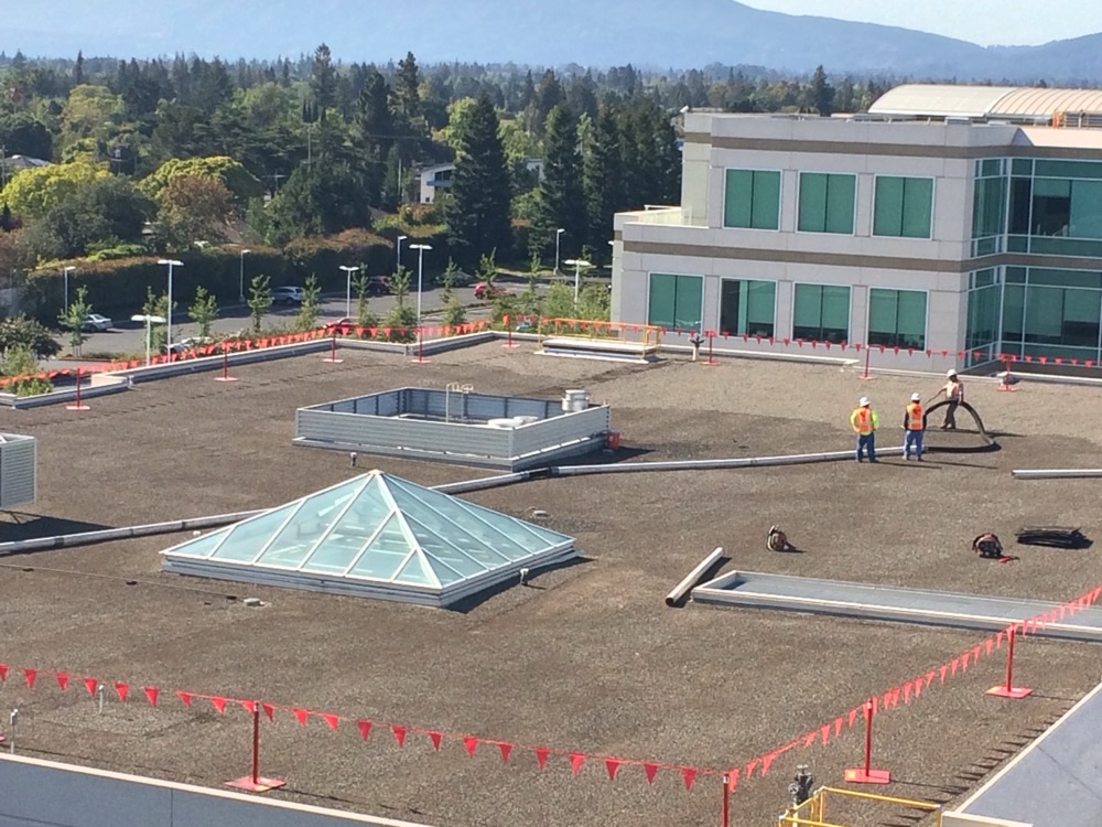 Before rooftop gravel removal